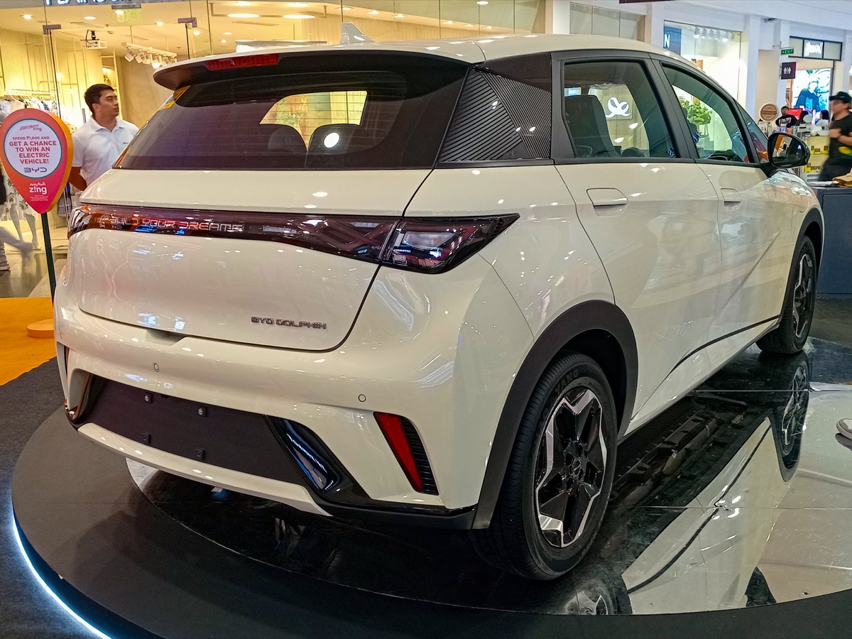 BYD Dolphin Cream White rear three-quarter view showing boot and tail design