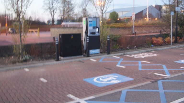 EV charging point at highway rest stop similar to TNB Electron network
