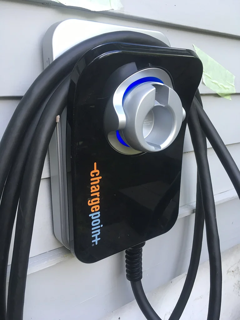 Home EV wallbox charger installed for electric vehicle charging