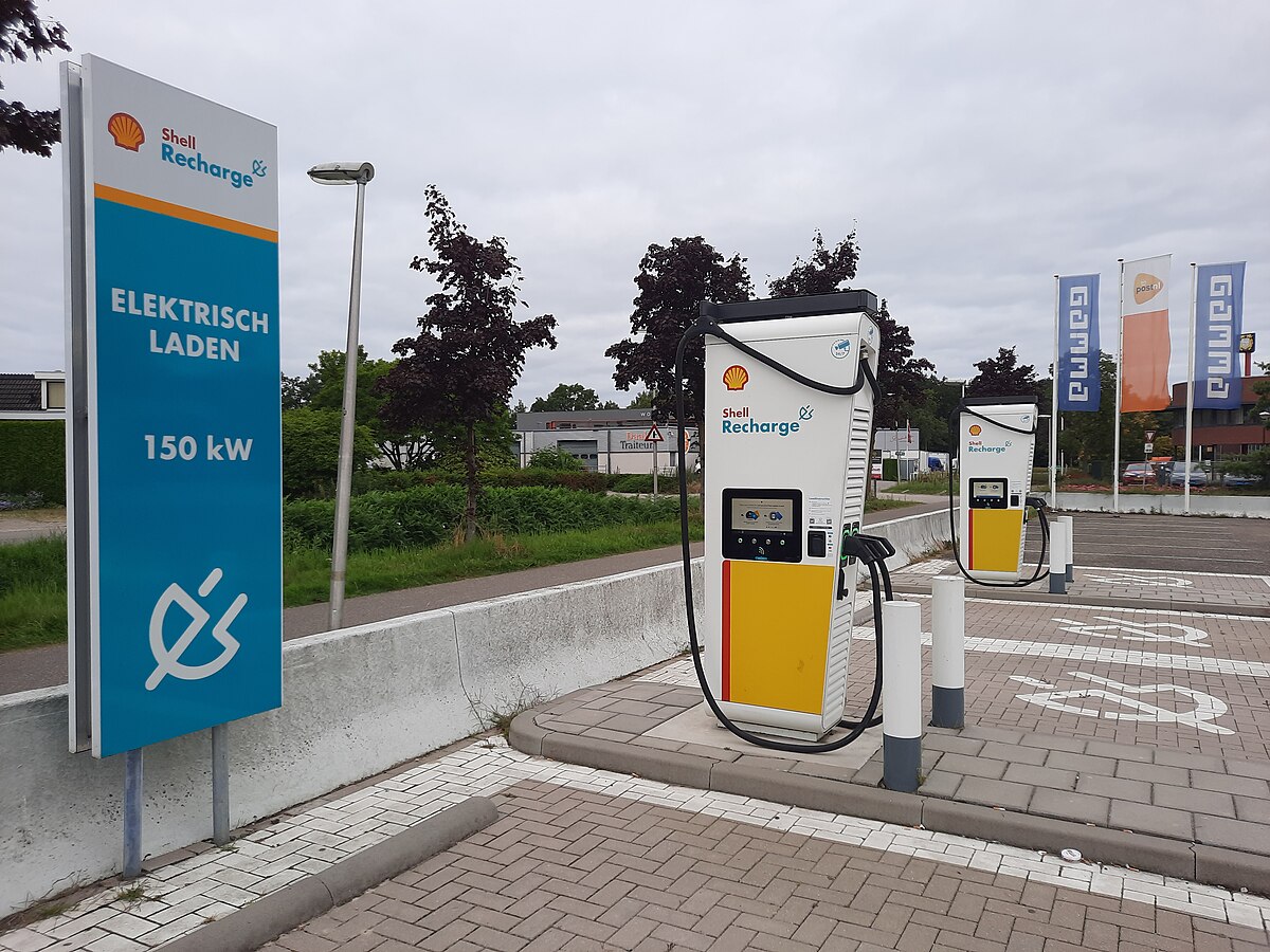 EV charging station at parking area showing home charger style wallbox unit