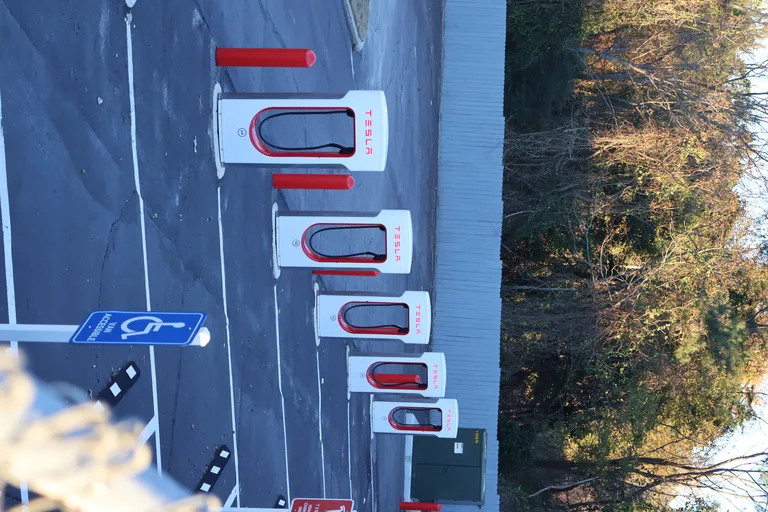 Row of Tesla V3 Supercharger stalls at a charging station