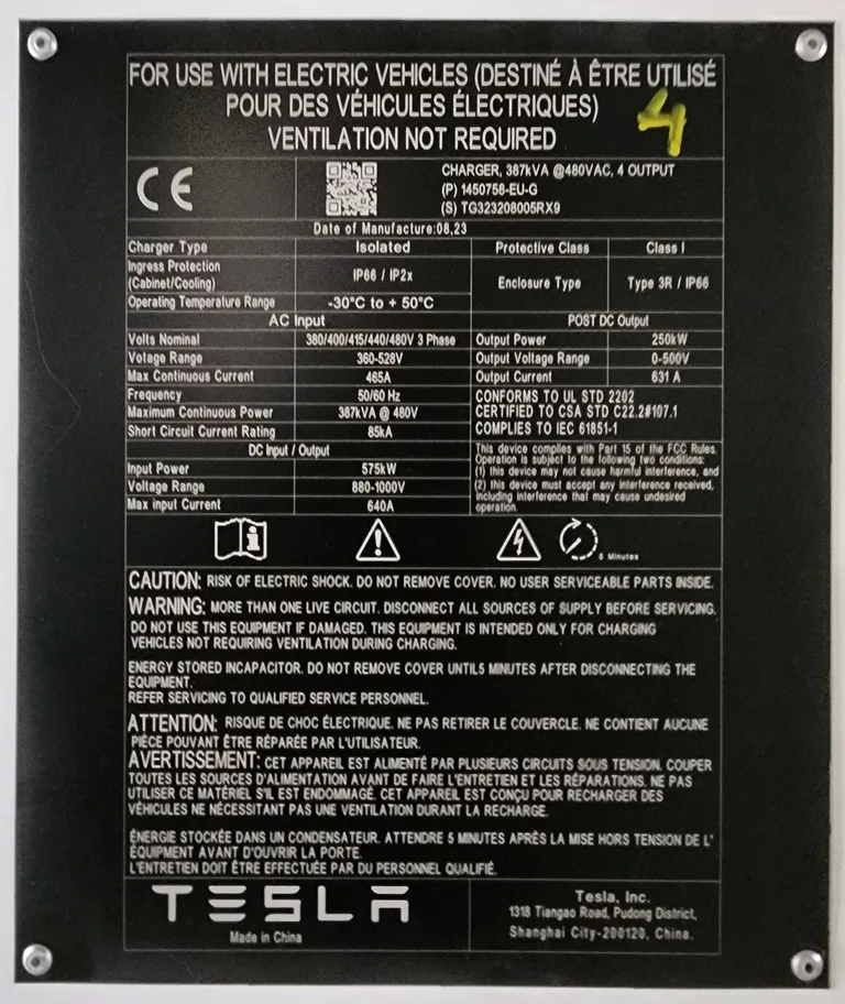 Tesla V4 Supercharger nameplate showing open network signage