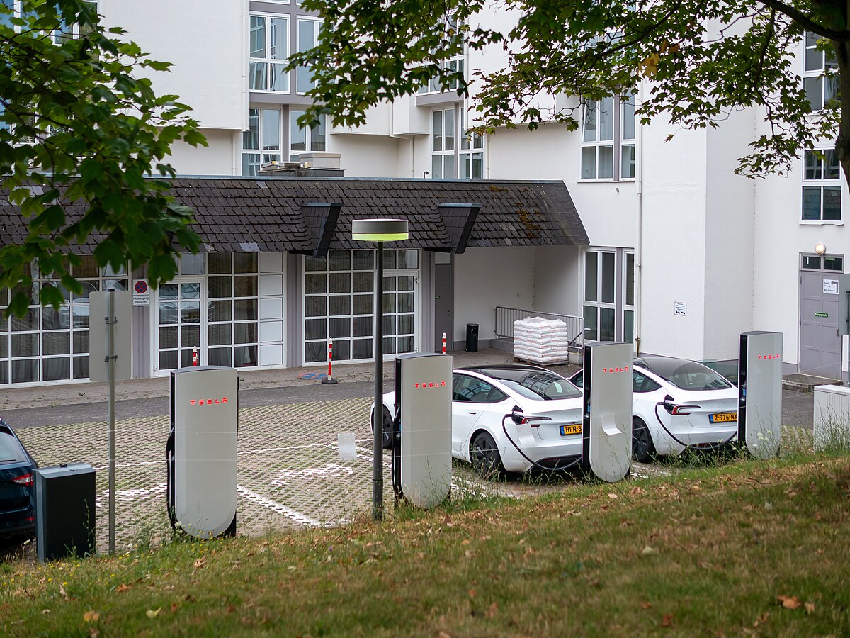 Tesla V4 Supercharger station with CCS2 connector for electric vehicle fast charging