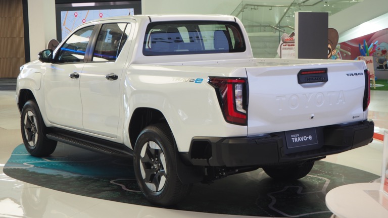 Toyota Hilux BEV rear three-quarter view showing tailgate design at Bangkok showroom