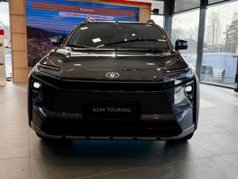 2026 Toyota bZ4X facelift front view — C-shaped DRL design