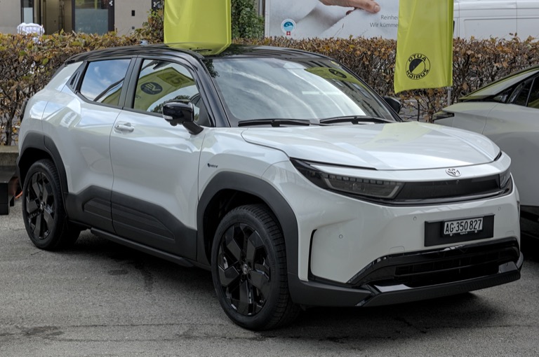 Toyota Urban Cruiser EV front three-quarter view at auto show 2025 — hammerhead LED design