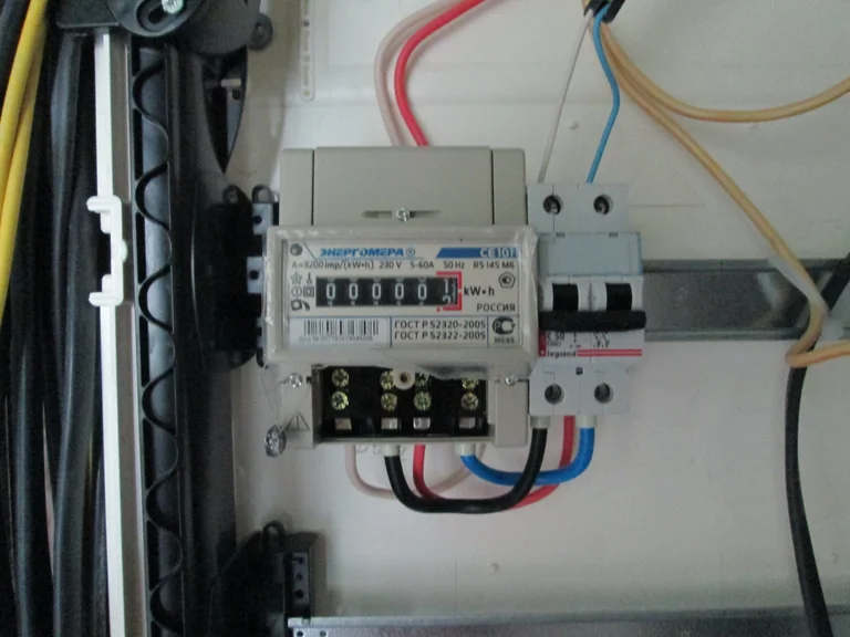 Residential electrical meter and MCB circuit breaker panel showing dedicated EV charger circuit setup